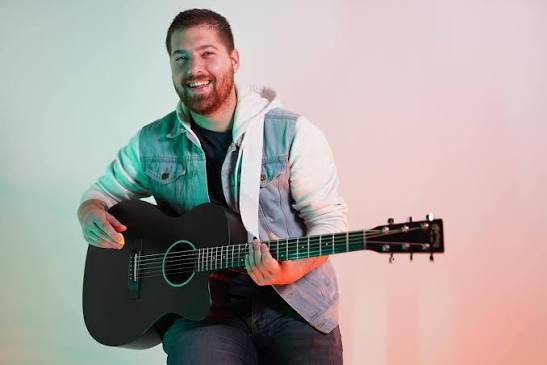 Delco Donnie — Jake Dillon with acoustic guitar